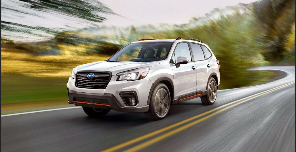 A white 2022 Subaru Forester on the road.