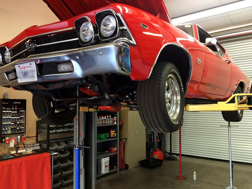 A car being worked on in a garage.