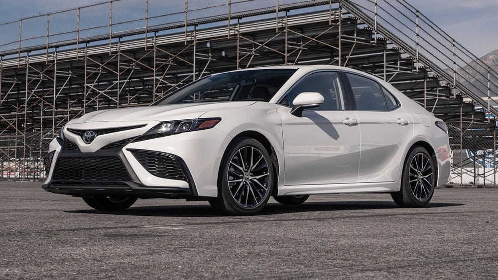 A parked white Toyota Camry