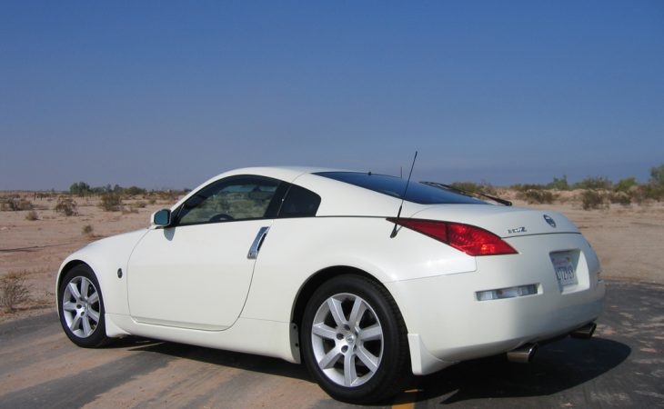 A parked white 2004 Nissan 350Z