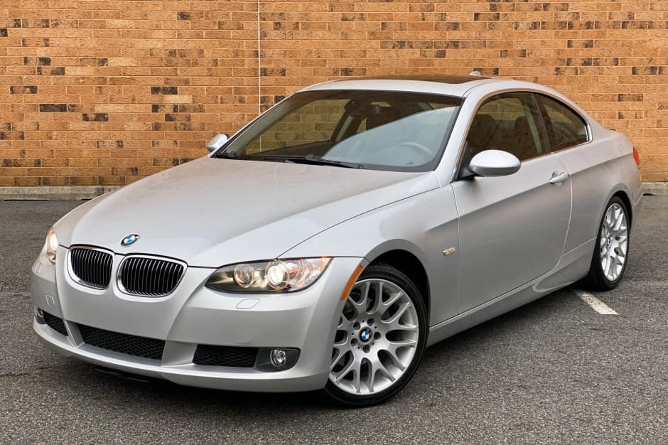 A parked silver 2008 BMW 328i