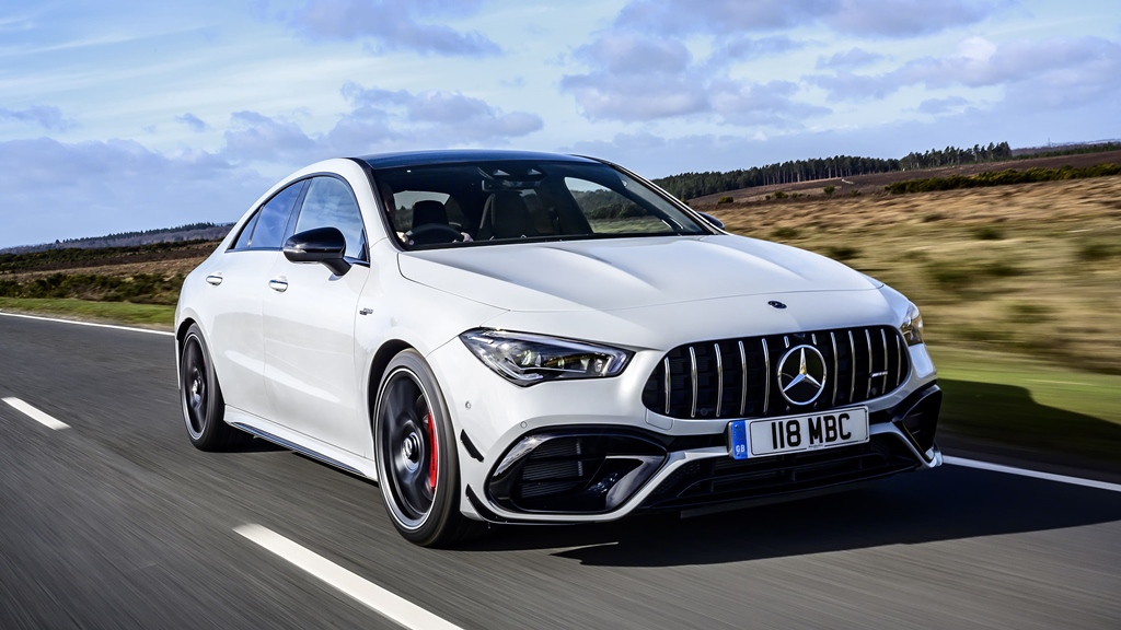 A white Mercedes-AMG CLA45 on the road