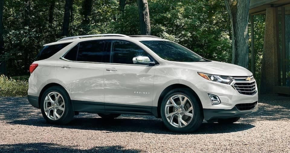 A parked pearl white 2019 Chevrolet Equinox
