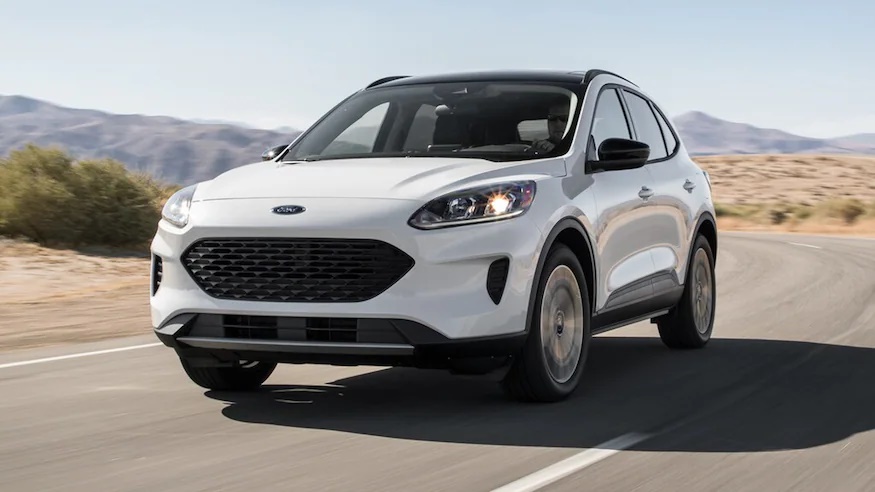 A white 2021 Ford Escape Hybrid on the move