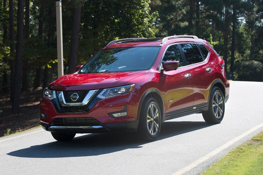 A parked red 2018 Nissan Rogue Hybrid