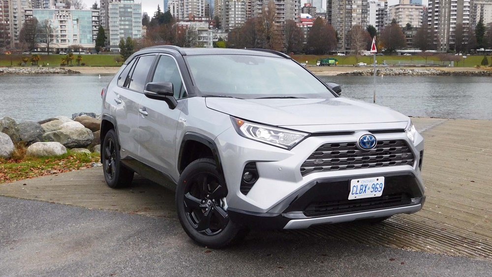 A parked silver 2021 Toyota RAV4 Hybrid