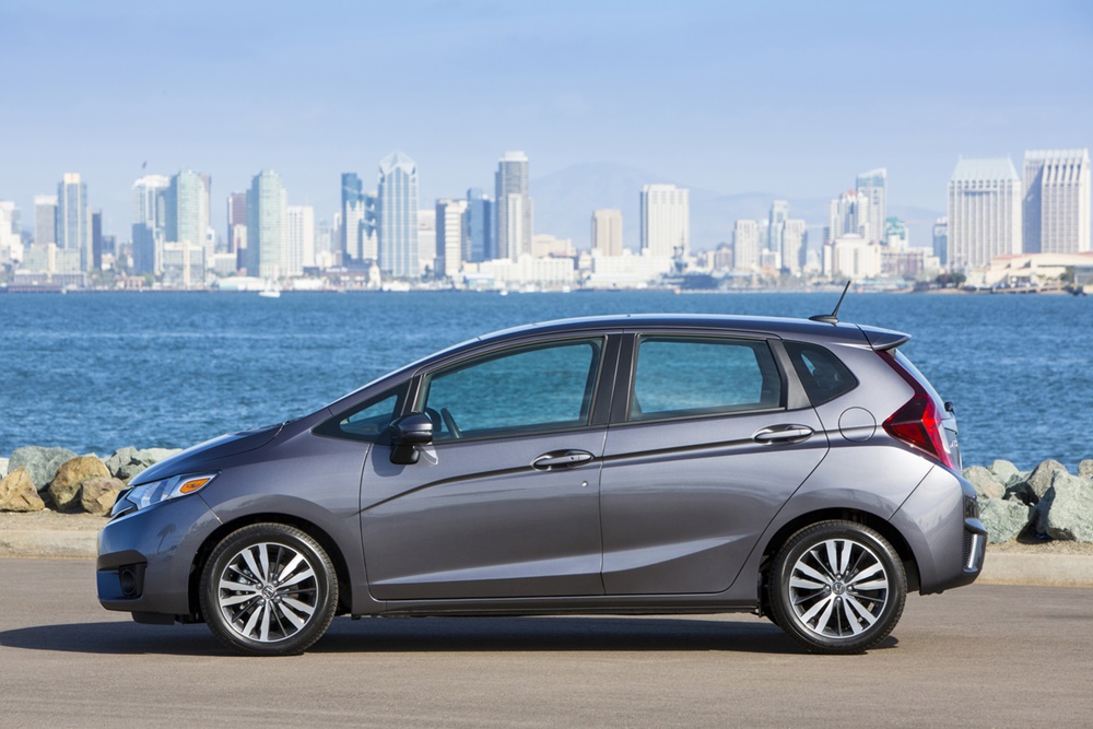 A parked silver 2017 Honda Fit