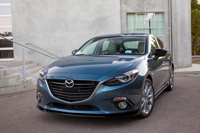 A parked blue 2016 Mazda 3