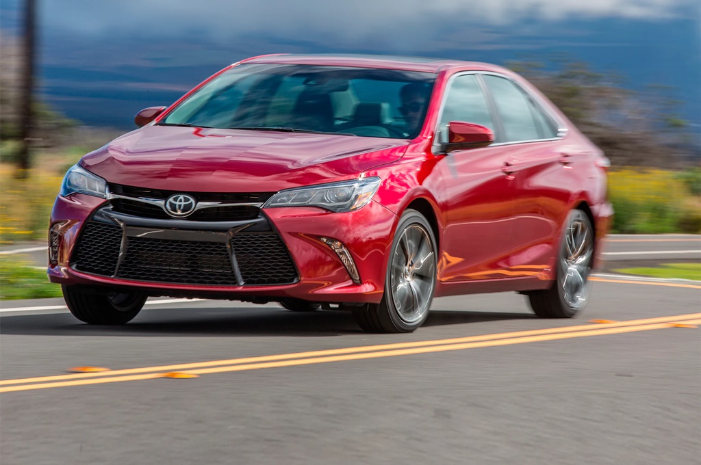 A red 2017 Toyota Camry on the road