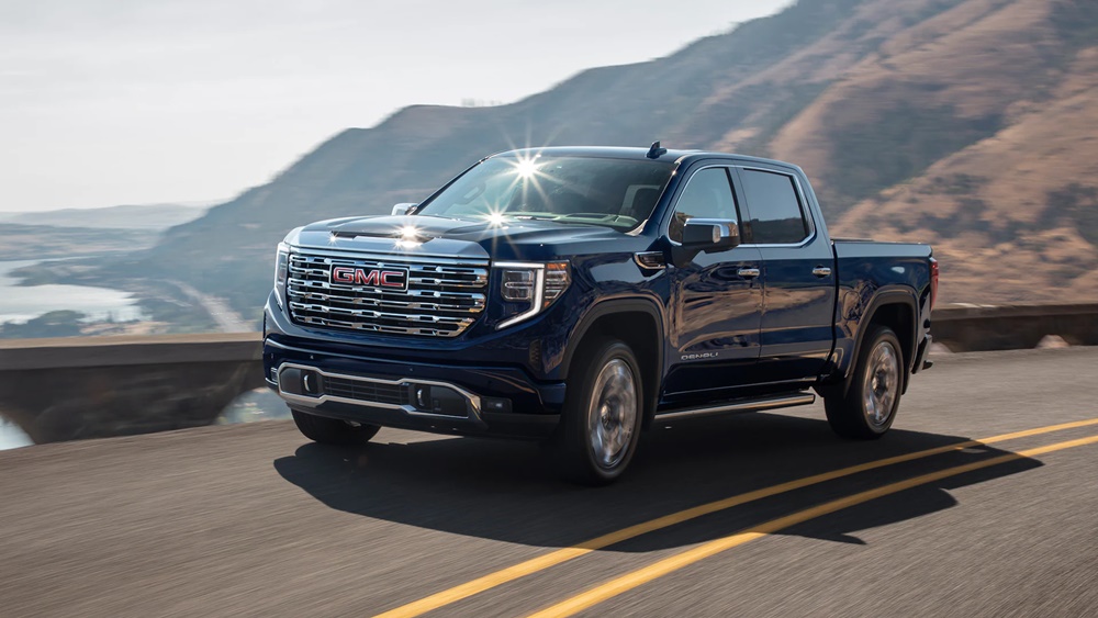 A metallic black 2022 GMC Sierra 1500 on the road