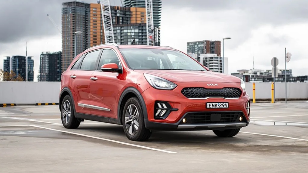 A parked orange 2022 Kia Niro Hybrid