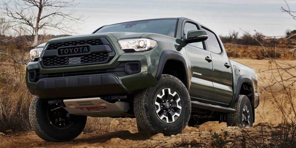 A dark green 2021 Toyota Tacoma on the move