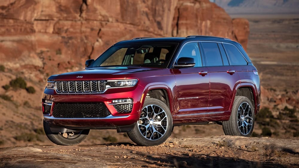 A parked red 2022 Jeep Grand Cherokee in the desert