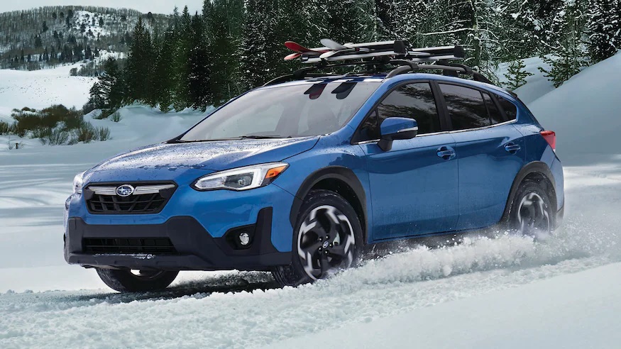 A blue 2022 Subaru Crosstrek in the snow