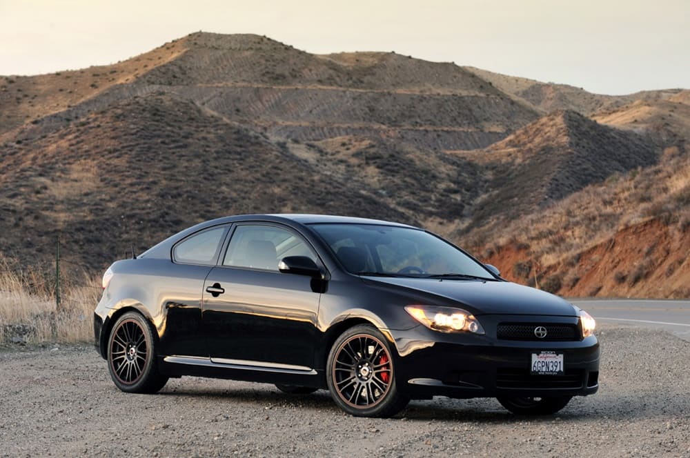 A parked black 2009 Scion tC