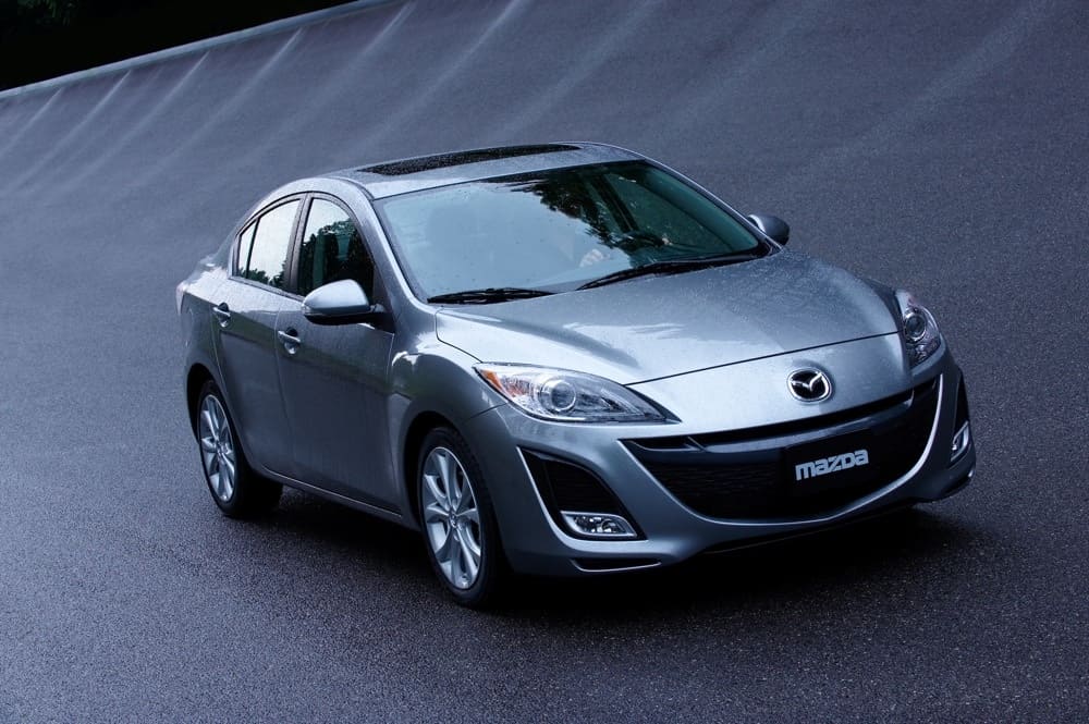 A parked silver 2010 Mazda3