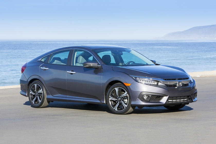 A parked silver 2018 Honda Civic on the beach