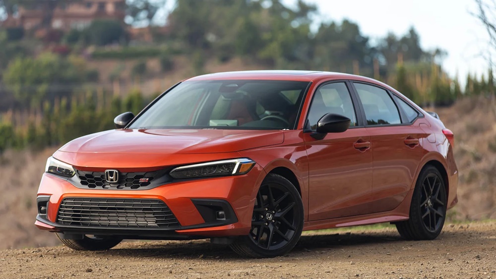 A parked orange 2022 Honda Civic Si