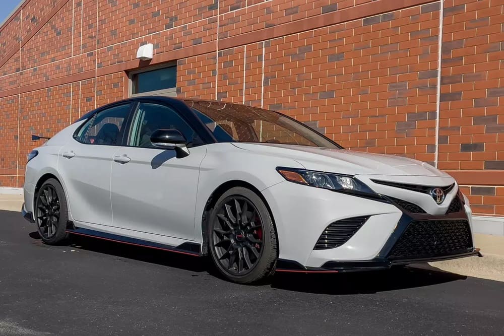 A parked white 2022 Toyota Camry TRD