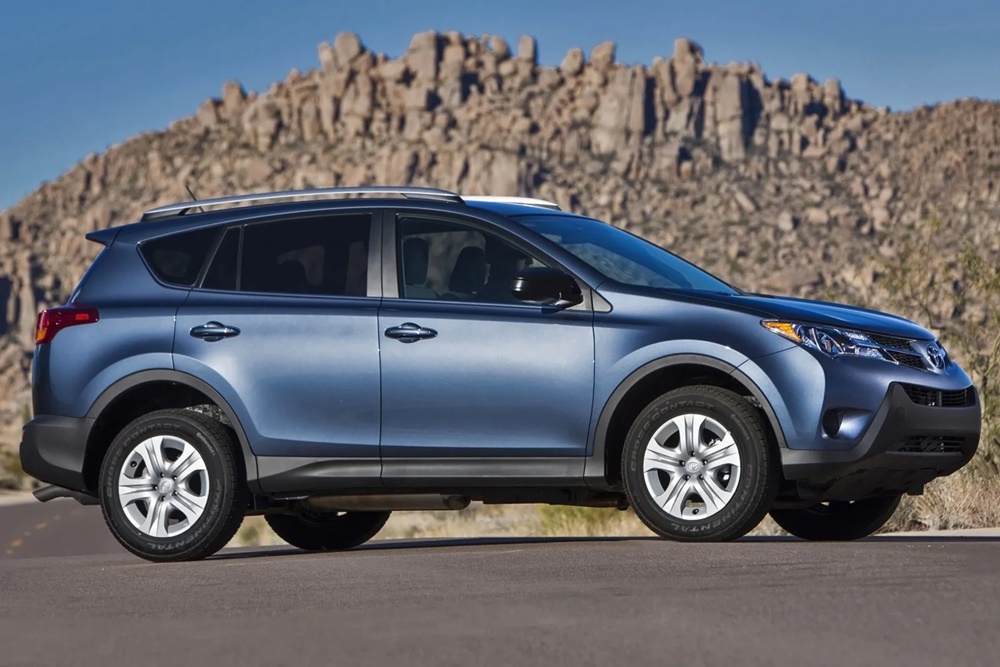 A parked blue 2014 Toyota RAV4