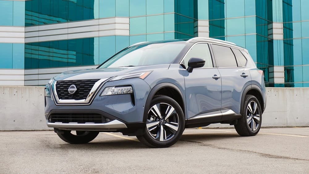 A parked light blue 2022 Nissan Rogue