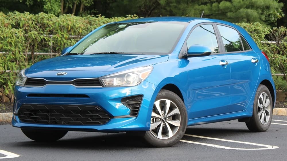 A parked blue 2022 Kia Rio