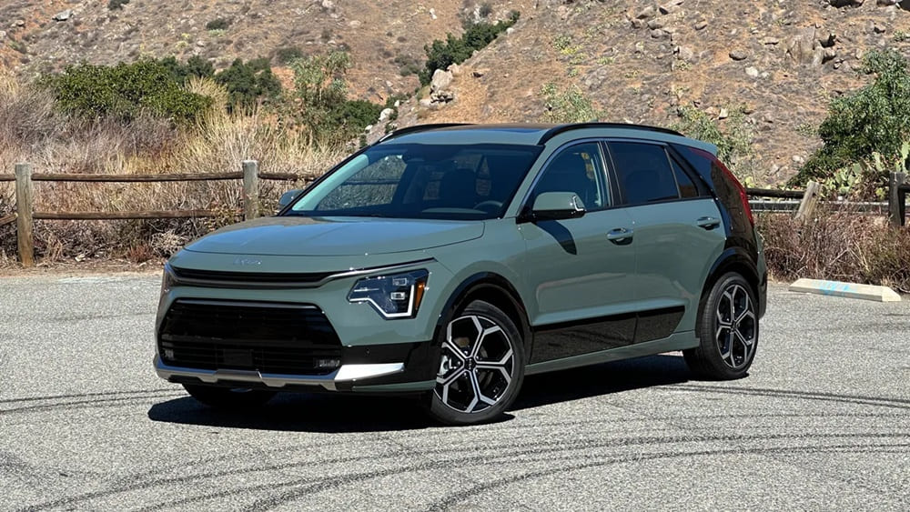 A parked grey-green 2023 Kia Niro Hybrid