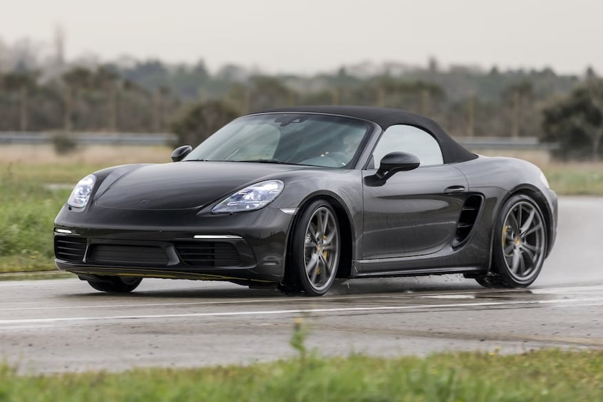 A black 2017 Porsche Boxster on the track