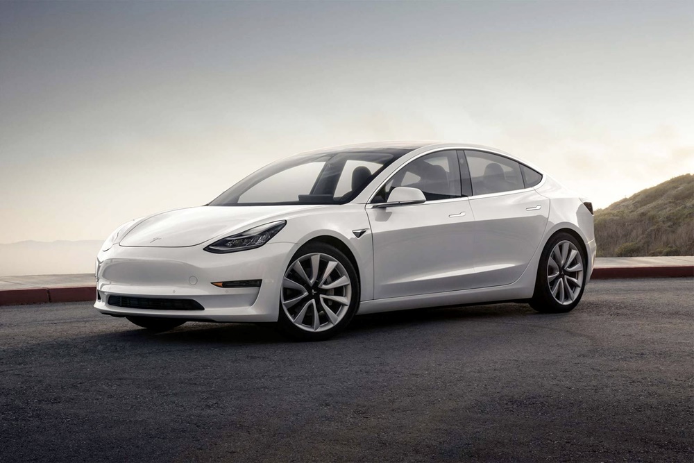 A parked white 2021 Tesla Model 3