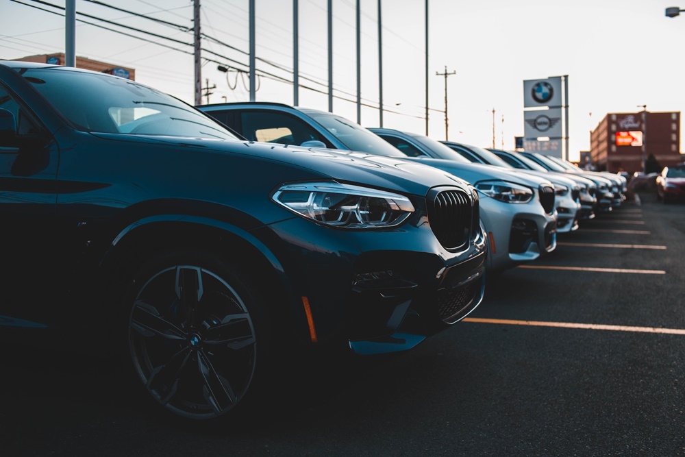 A row of cars at a car dealership