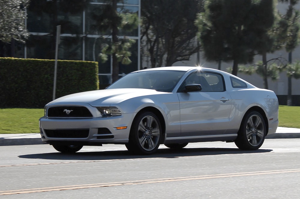 A parked silver 2014 Ford Mustang
