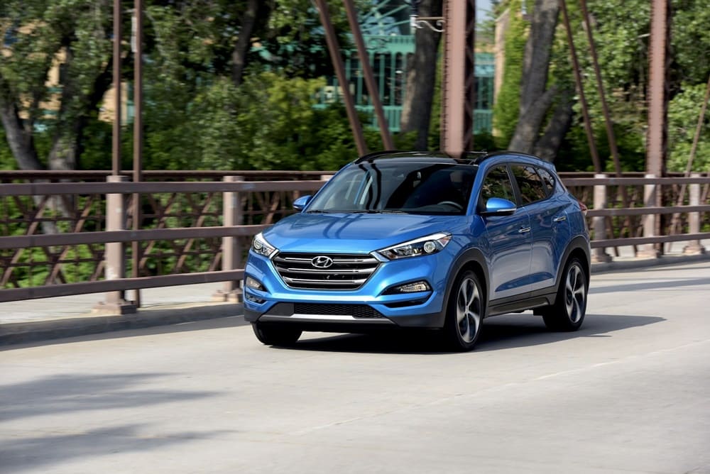 A blue 2018 Hyundai Tucson on the move