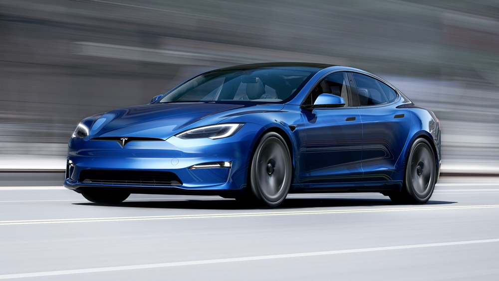 A blue 2023 Tesla Model S Plaid on the road
