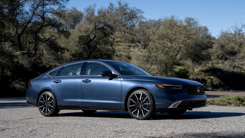 A parked blue 2023 Honda Accord Hybrid