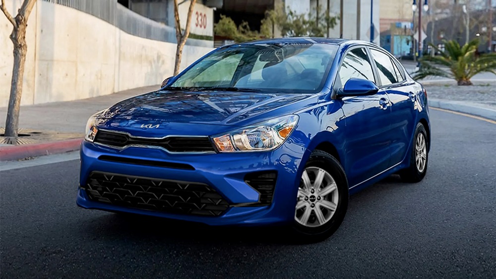 A parked blue 2023 Kia Rio