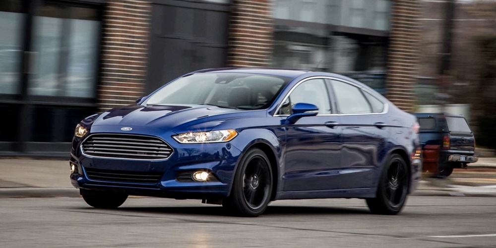 A blue 2016 Ford Fusion on the road