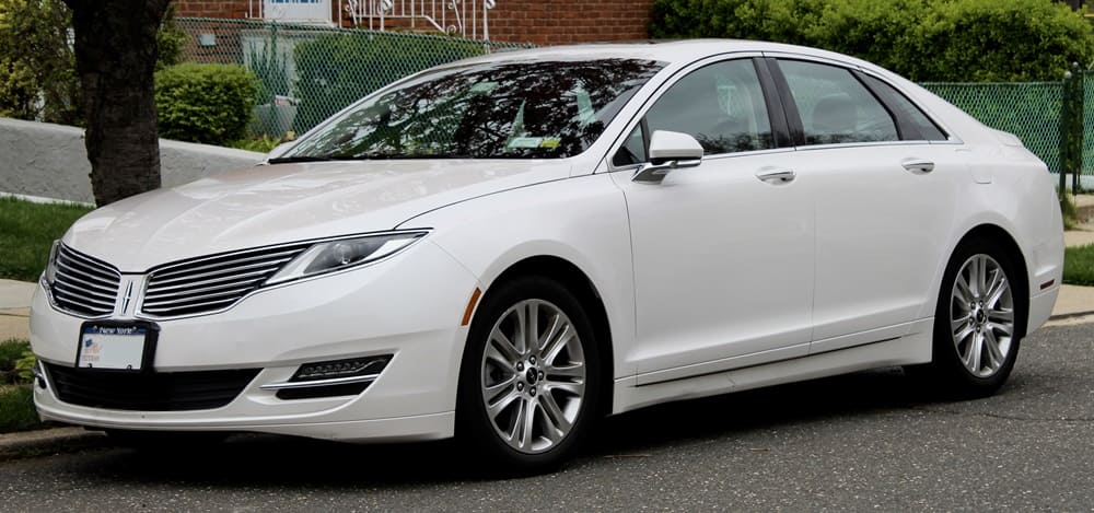 A parked white 2016 Lincoln MKZ