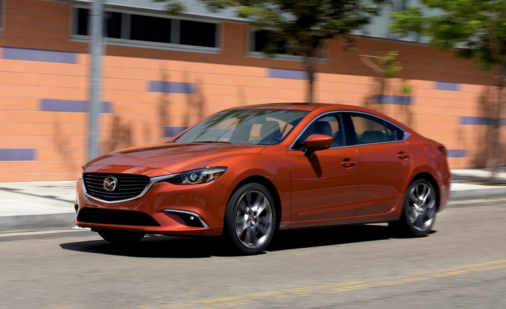 An orange 2017 Mazda Mazda6 on the move