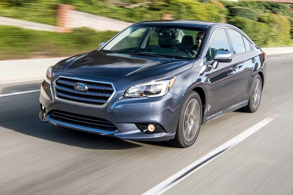 A blue 2017 Subaru Legacy on the road