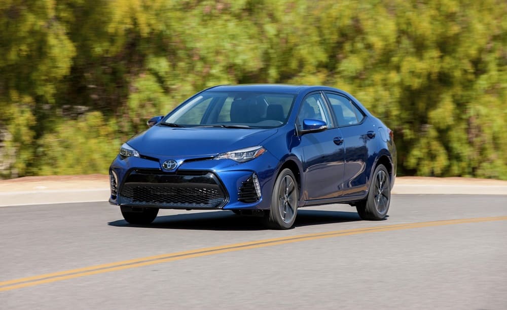 A blue 2017 Toyota Corolla on the road