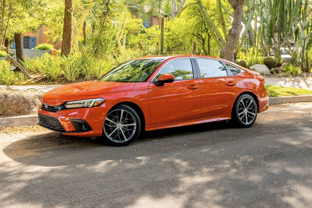 A parked orange 2023 Honda Civic