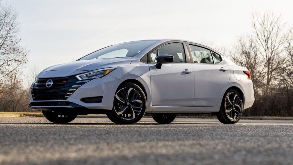 A parked white 2023 Nissan Versa