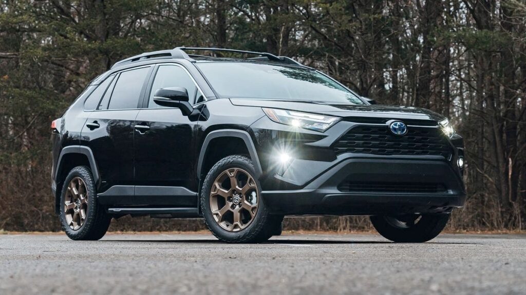 A parked black 2023 Toyota RAV4 Hybrid