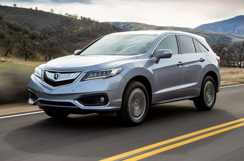 A silver 2016 Acura RDX moving down the road