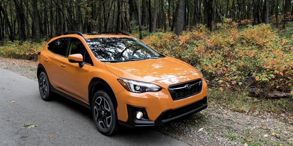 A parked orange 2018 Subaru Crosstrek