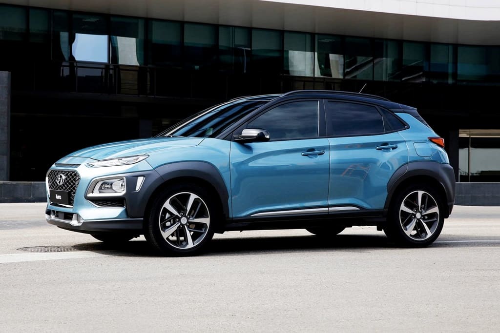 A parked light blue 2021 Hyundai Kona