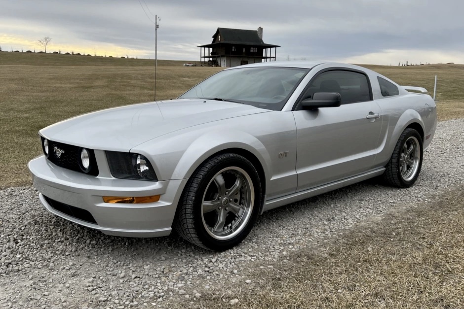 A parked silver 2005 Ford Mustang GT