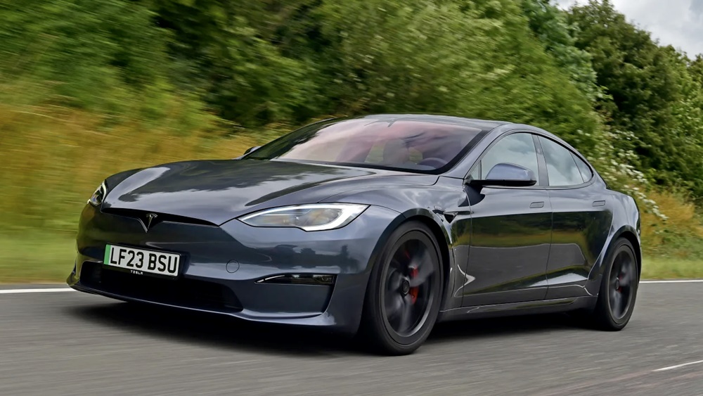 A black 2023 Tesla Model S Plaid on the road