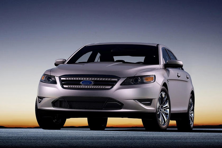A parked silver 2012 Ford Taurus SHO