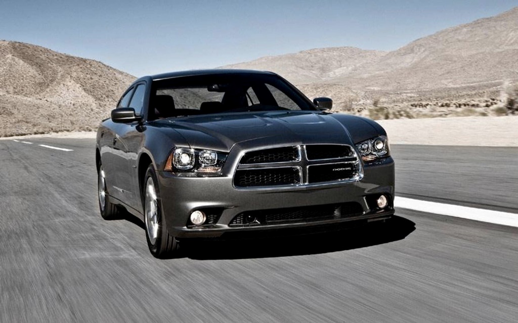 A black 2013 Dodge Charger on the road